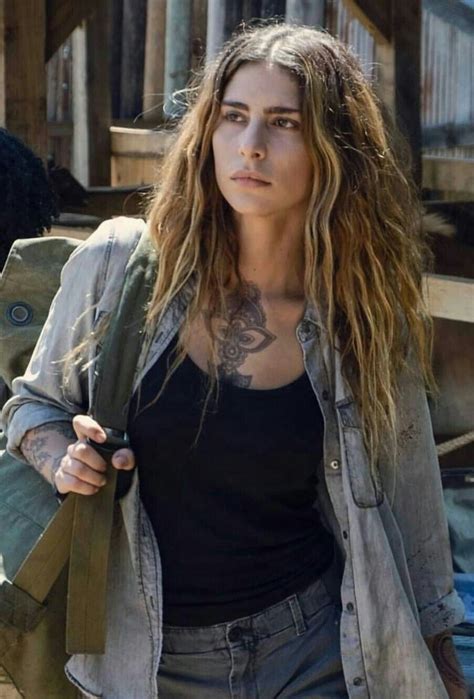 Woman With Long Hair And Tattoos Walking