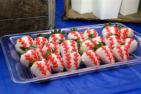 A Plastic Tray Filled With White Chocolate Covered Strawberries And Topped With Red Sprinkles