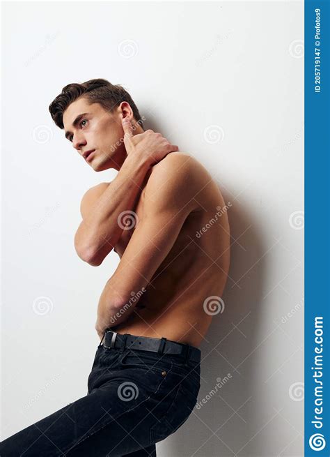 Guy With A Naked Torso Holds His Hand Behind His Head Pants Model Stock Image Image Of Body