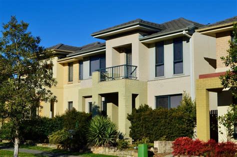 A Row Of Houses In The Suburbs On A Sunny Afternoon Stock Photo Image