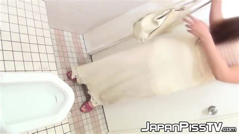 Japanese Chick With Hairy Pussy Peeing In Public Toilet