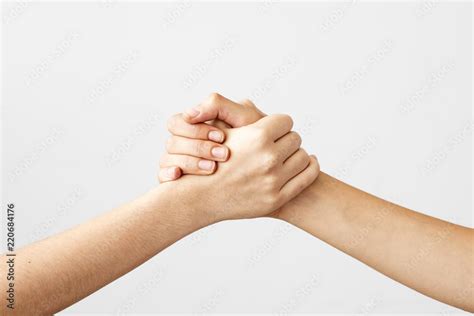 Two Hands Holding Each Other Strongly Stock Photo Adobe Stock