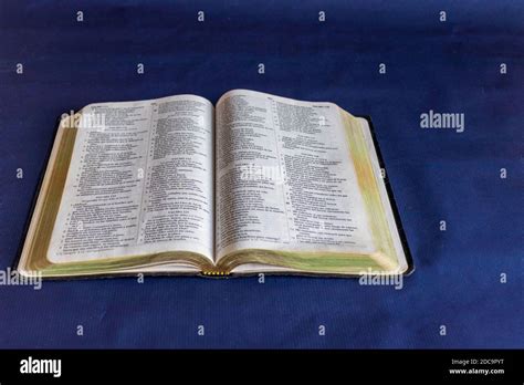 Holy Bible Book On A Blue Background Stock Photo Alamy