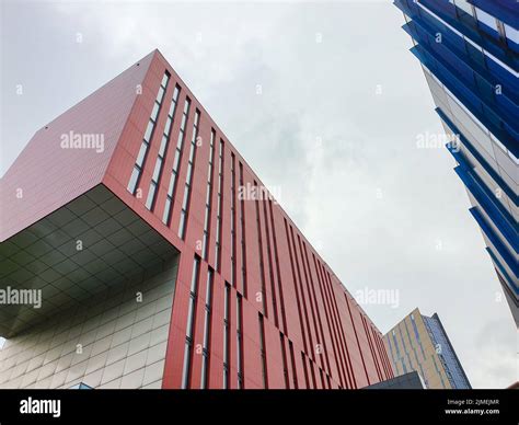 Contrasting Colors And Shapes On Building Facades Against The Sky In