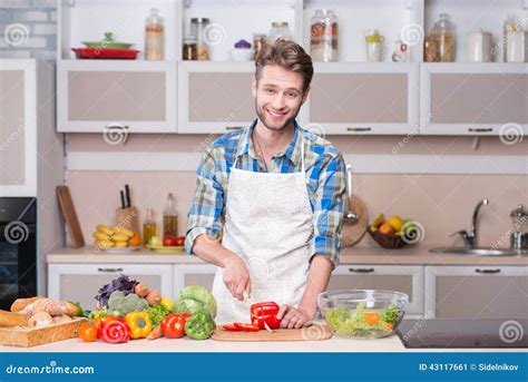 Young Smiling Man Cooking Dinner In Kitchen Stock Image Image Of