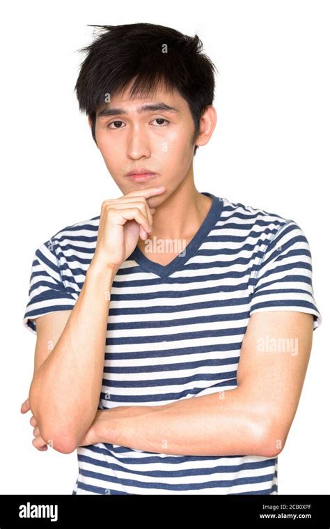 Portrait Of Young Handsome Asian Man Thinking Stock Photo Alamy