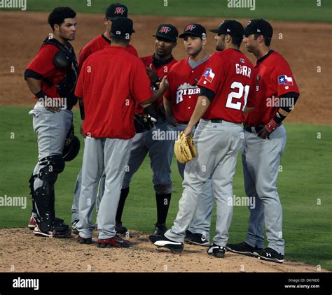 The Frisco Roughriders gather on the mound in the bottom of the fourth ...