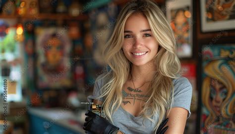 Blonde Tattoo Artist Mastering Her Craft In The Tattoo Salon Portrait Of A Talented Female