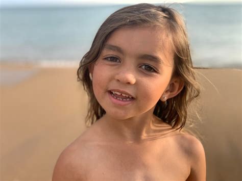 Premium Photo Portrait Of Smiling Shirtless Girl At Beach