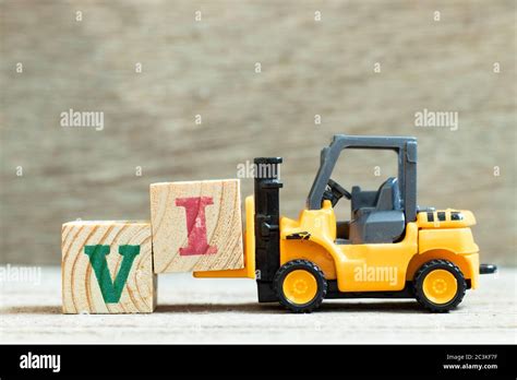 Toy Forklift Hold Letter Block To Complete Word Vi Abbreviation For