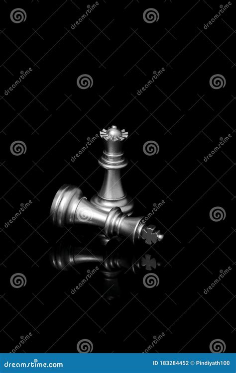 Silver Chess Pieces King And Queen Isolated On Black Background Stock