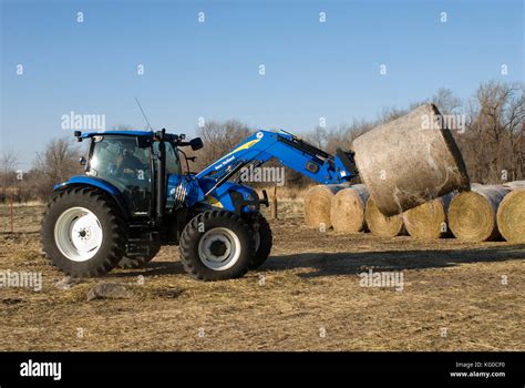 New Holland T6030 Tractor Picking Up Round Hay Bales With New 840tl