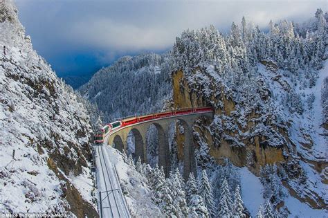 The Bernina Express Adds A Splash Of Red To Snow Covered Switzerland