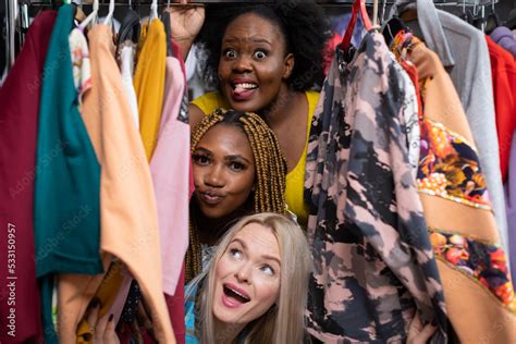 The Blonde Laughs Mouth For A Kiss The African Woman Sticks Out Her Tongue Stock Photo