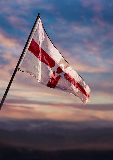 Bailiwick of Jersey Flag, Jersey Flag Waving on Sky at Dusk Stock Photo ...