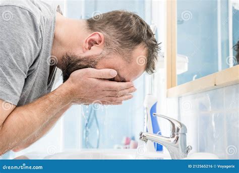 Man Washing His Face In Bathroom Stock Photo Image Of Soap Sink