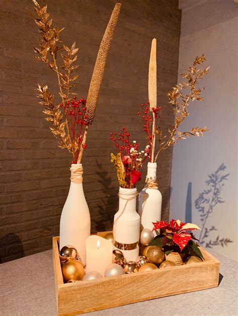 Three White Vases With Red And Gold Decorations On A Wooden Tray In