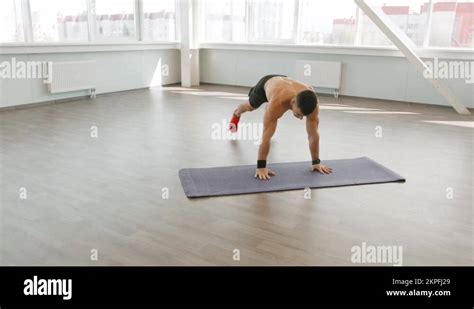 Muscular Man With A Naked Torso Doing Push Ups With Jumping And Moving