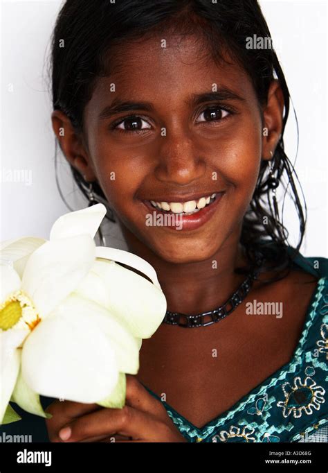 Pretty Local Girl Holds Lotus Flower Offering At Dambulla Buddhist Cave