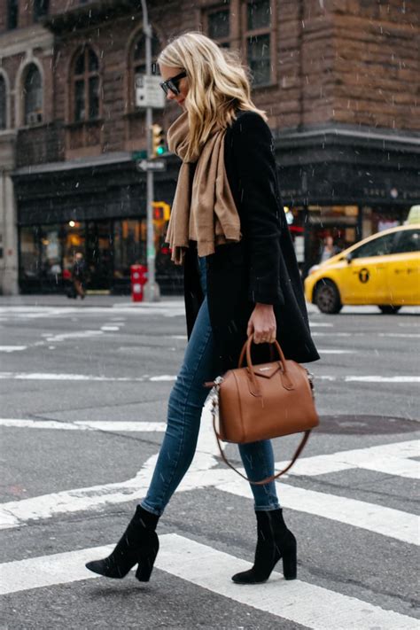 Blonde Woman Wearing Tan Scarf Black Wool Coat Denim Skinny Jeans Black