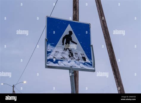 Longyearbyen snow-covered pedestrian crossing sign, Svalbard Stock ...