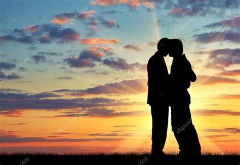 Silhouette of two gay men kissing — Stock Photo © Prazisss #88662806