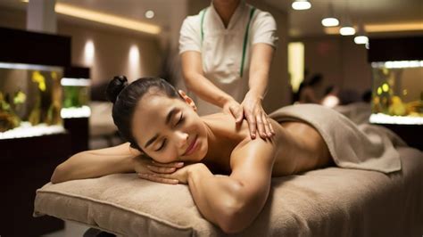 Naked Woman Receiving Back Massage From Masseur At Spa Premium AI Generated Image