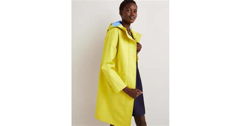 Boden Waterproof Longline Raincoat In Yellow Lyst