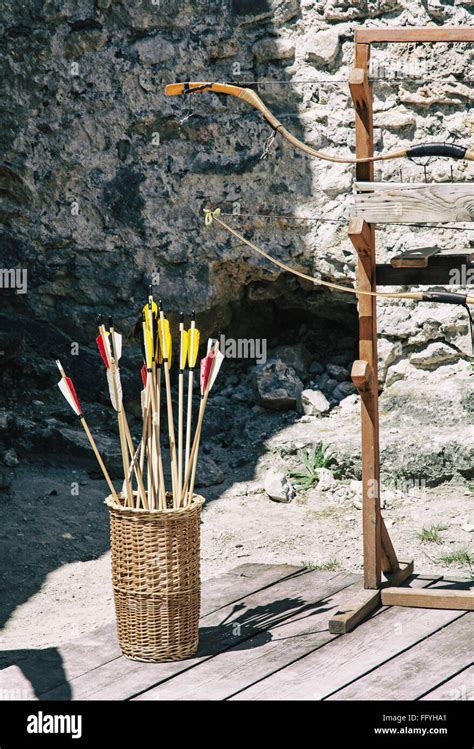 Vintage Bow And Arrows With Ruins Wall Background Outdoor Activity