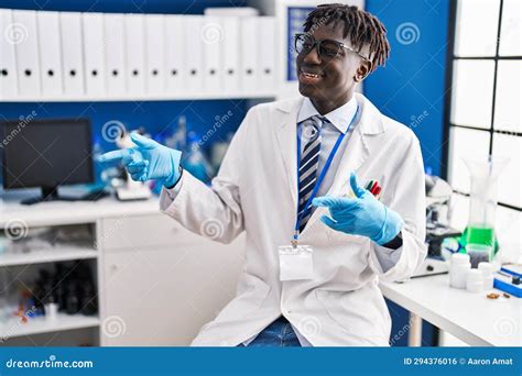 African American Man Scientist Smiling Confident Speaking At Laboratory