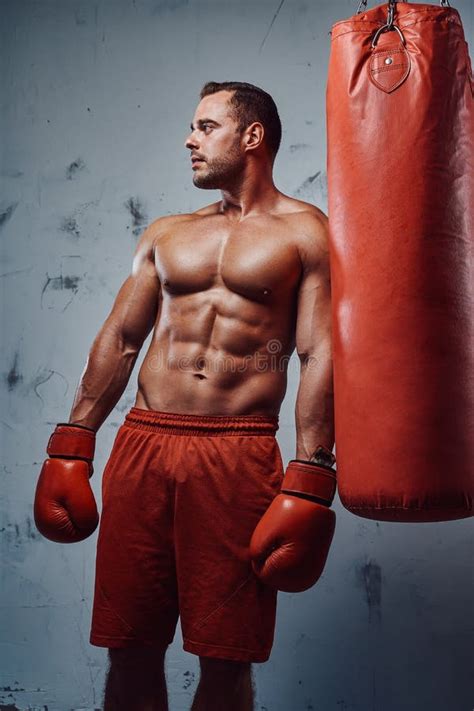 Muscular Man With Naked Torso Posing With Punching Bag Stock Image Image Of Defense