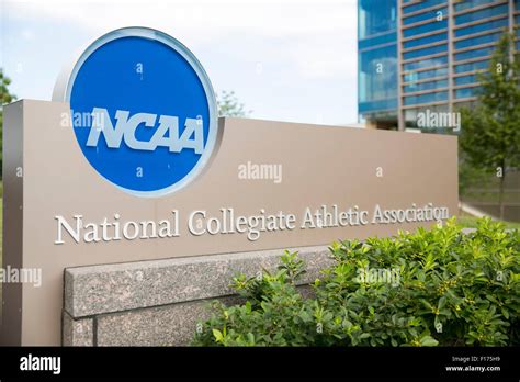 A logo sign outside of the headquarters of the National Collegiate ...
