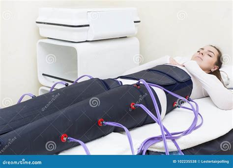 Woman At The Clinic For The Treatment Of Pressure Therapy Stock Photo