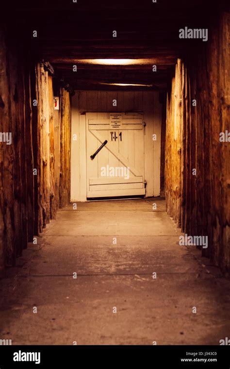 A Wooden Door At The End Of A Tunnel In The Underground Salt Mine Of