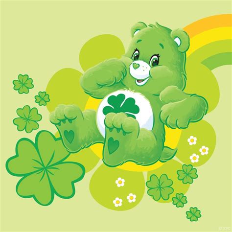 A Green Teddy Bear Sitting On Top Of Clover Leaves And Holding A White