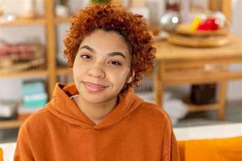 Beautiful African American Girl With Afro Hairstyle Smiling Sitting On