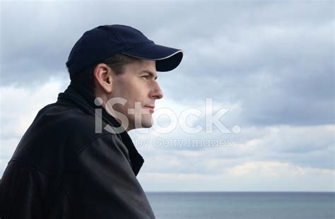 Man Watching The Coastline Stock Photo Royalty Free Freeimages