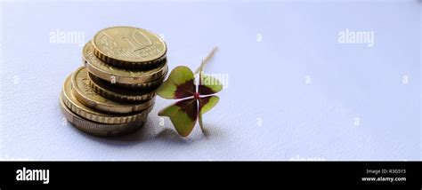 Tower Of Euro Cents And Cloverleaf Isolated On White Background Euro