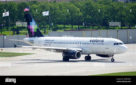 Volaris Airbus A320 Plane Taxies On The Runway After Landing At Chicago