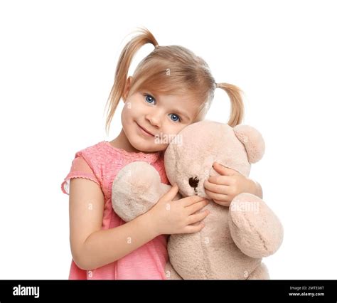 Cute little girl with teddy bear on white background Stock Photo - Alamy