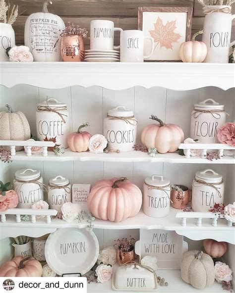 A White Shelf Filled With Lots Of Different Types Of Pumpkins And Other