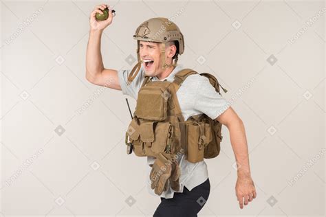 Male Journalist Screaming And Going To Throw A Grenade Photo