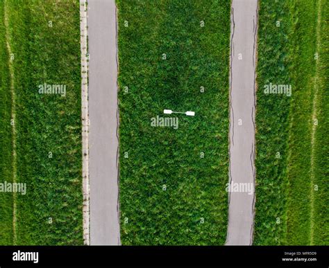 Rural road in fields,aerial view, top down from drone Stock Photo - Alamy