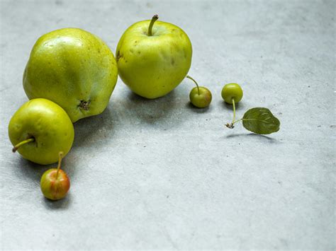 Red Apple With Two Green Apples · Free Stock Photo