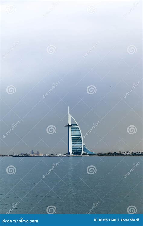 Waterfront View Of Burj Al Arab Under Cloudy Sky Seven Star Hotel A