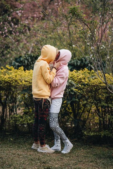 Lesbian Couple Hugging In Sakura Garden Stock Photo Image Of Couple