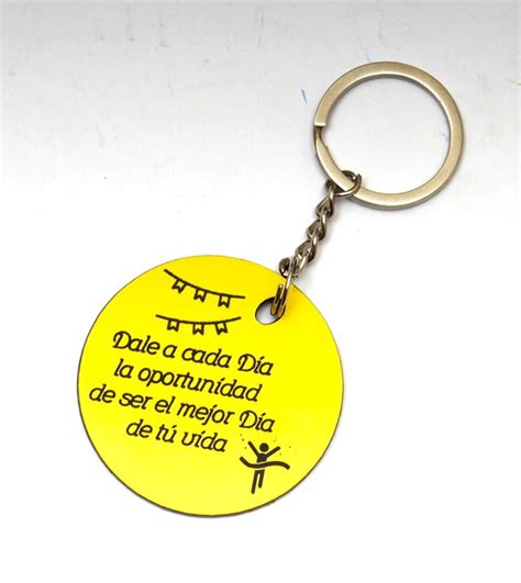 A Yellow Key Chain With A Quote On It