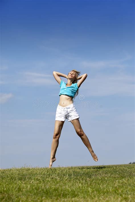 Woman Jumps In A Summer Green Field Stock Photo Image Of Relaxation