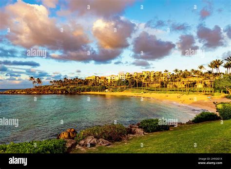 Tourists enjoying Kapalua Beach on Kapalua Bay at sunset; Maui, Hawaii ...