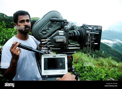 Indian film shooting spots Camera man looking camera Stock Photo - Alamy